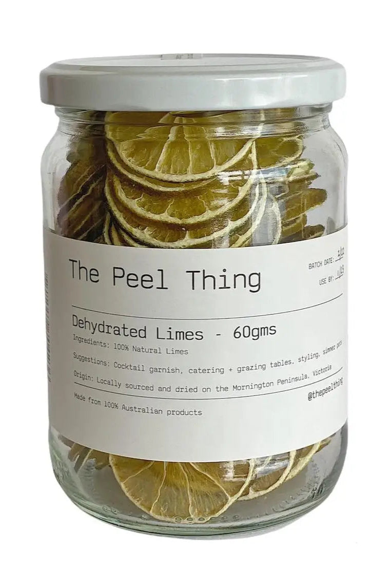 Jar of dehydrated limes with a label on a white background