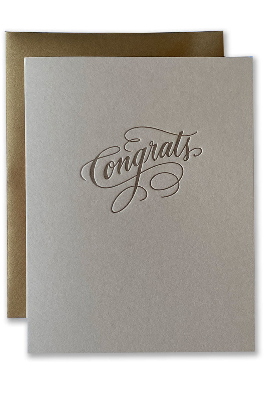 Gray greeting card with 'Congrats' text and brown envelope on white background