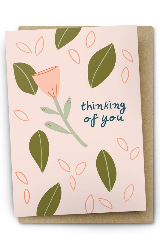 Greeting card with floral design and 'thinking of you' text on a white background
