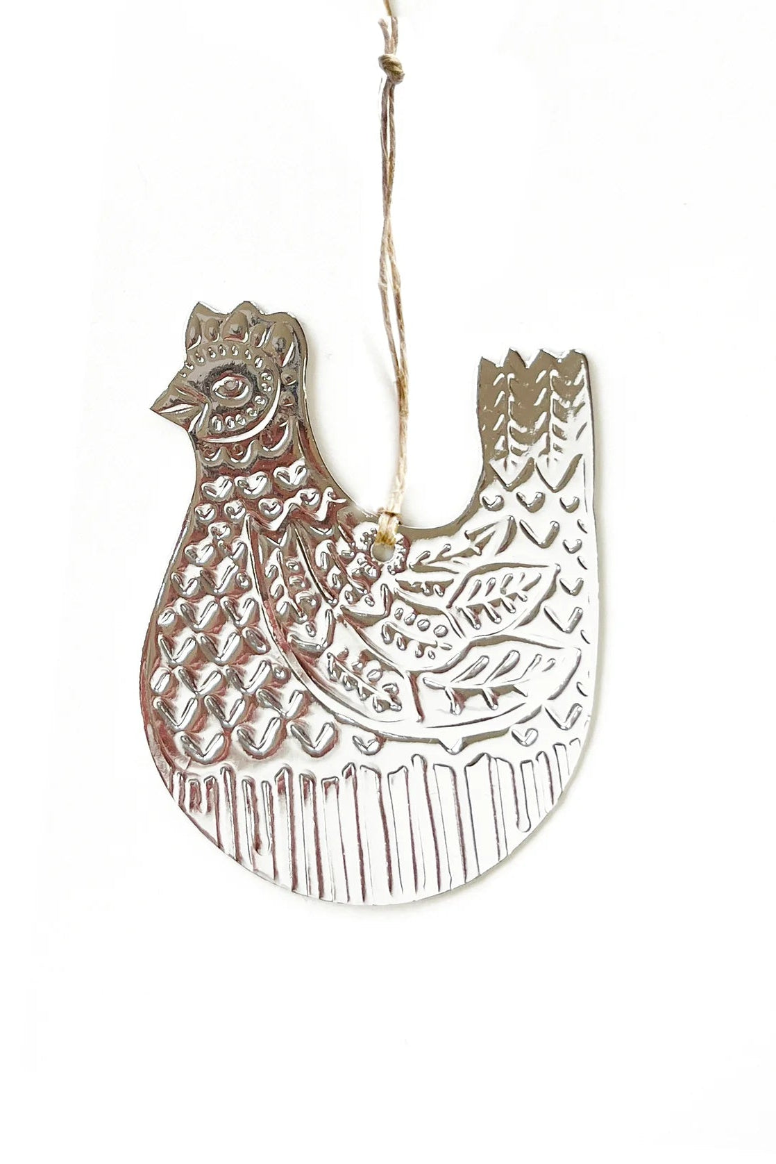 Decorative metal rooster ornament on a white background